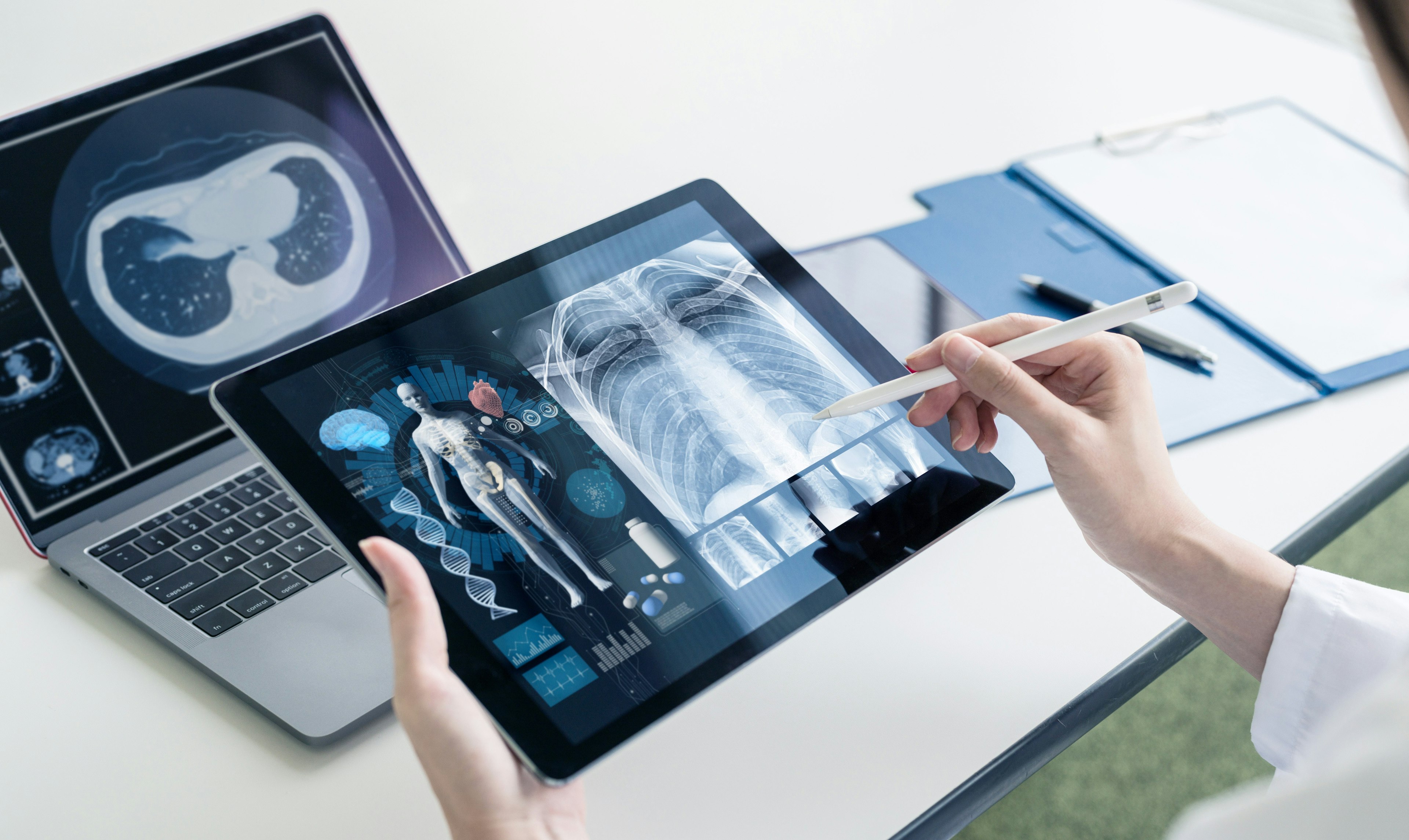 Doctor using ipad xrays