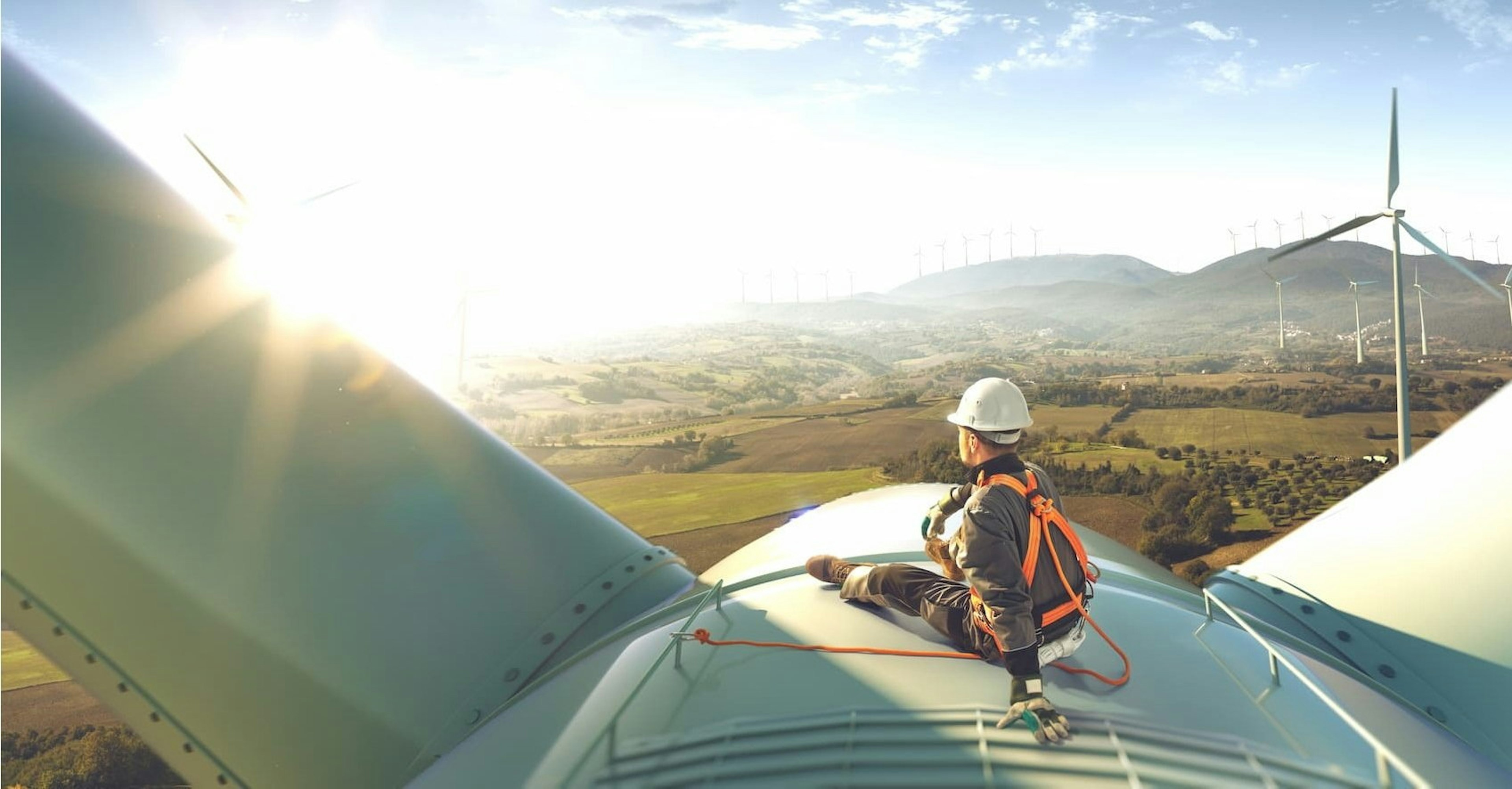 Worker on top of a wind mill